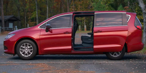A side profile photo of a red 2025 Chrysler Voyager taken near Fort Gratiot Township, MI