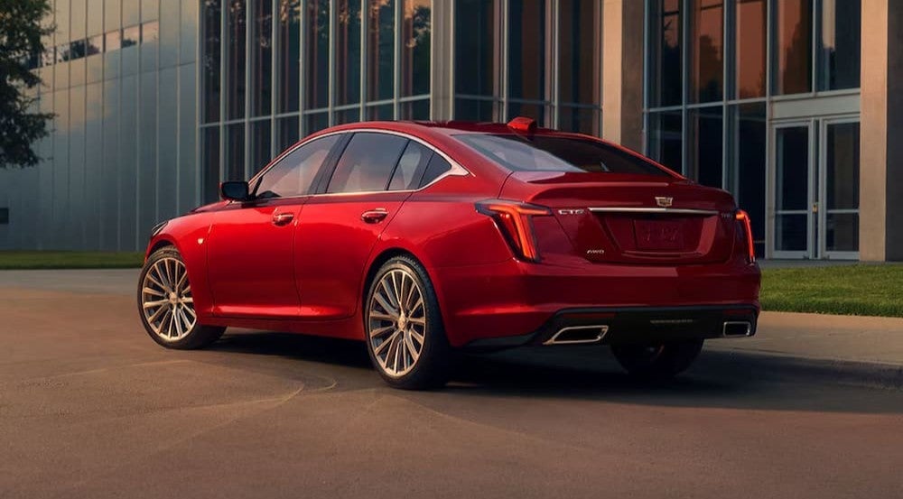 A red 2026 Cadillac CT5 parked in a city.