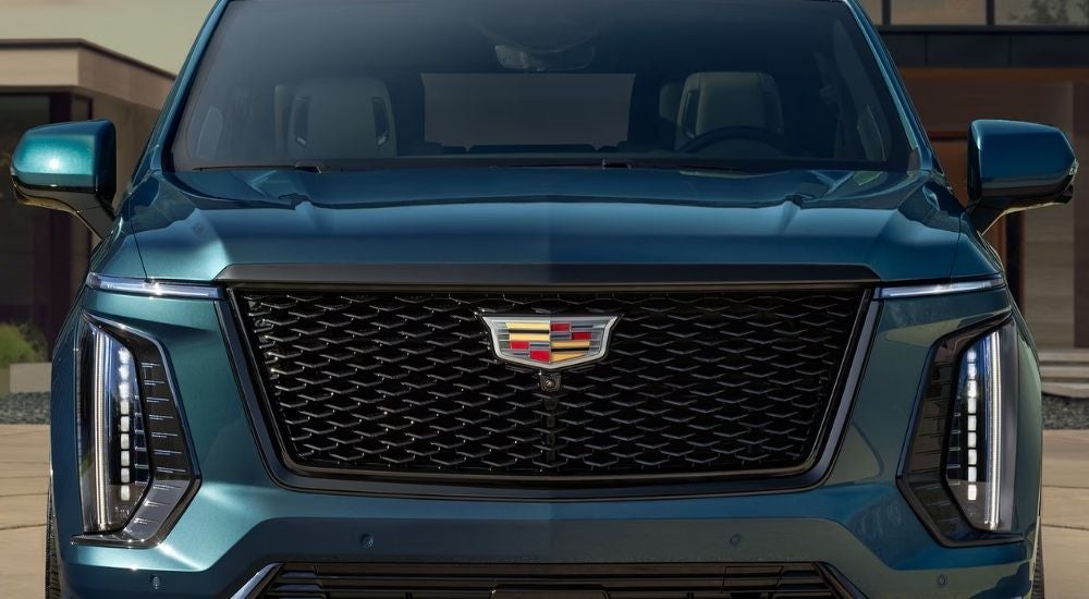 Grille of a green 2026 Cadillac Escalade