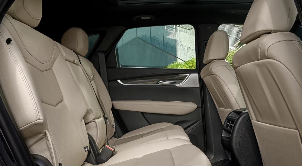 Tan leather seating is shown in a 2025 Cadillac XT5.