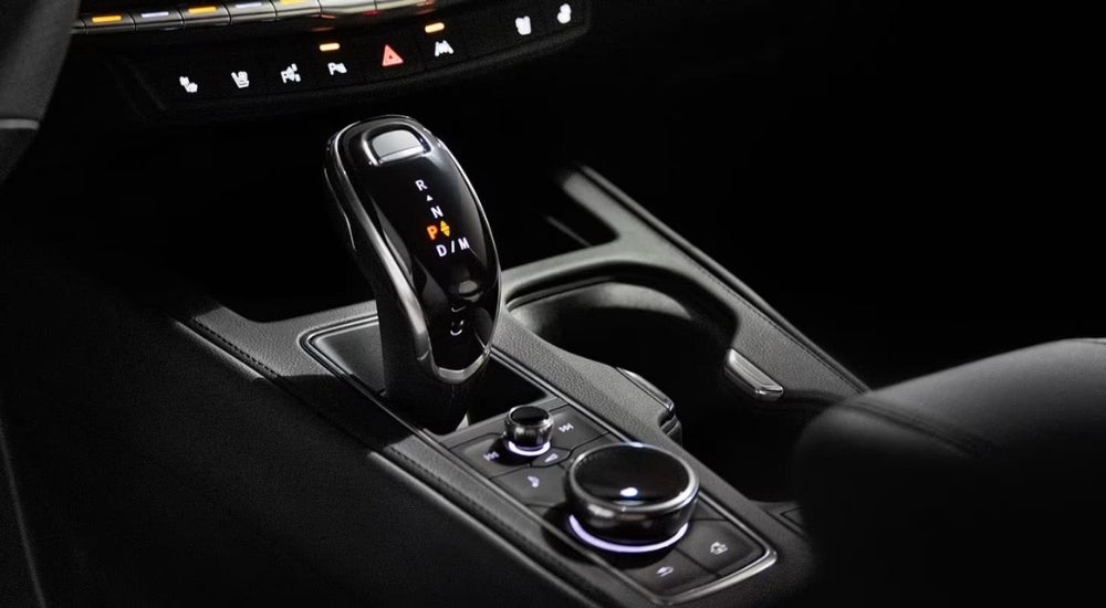 A close up shows the shifter in the black interior of a 2023 Cadillac XT4.