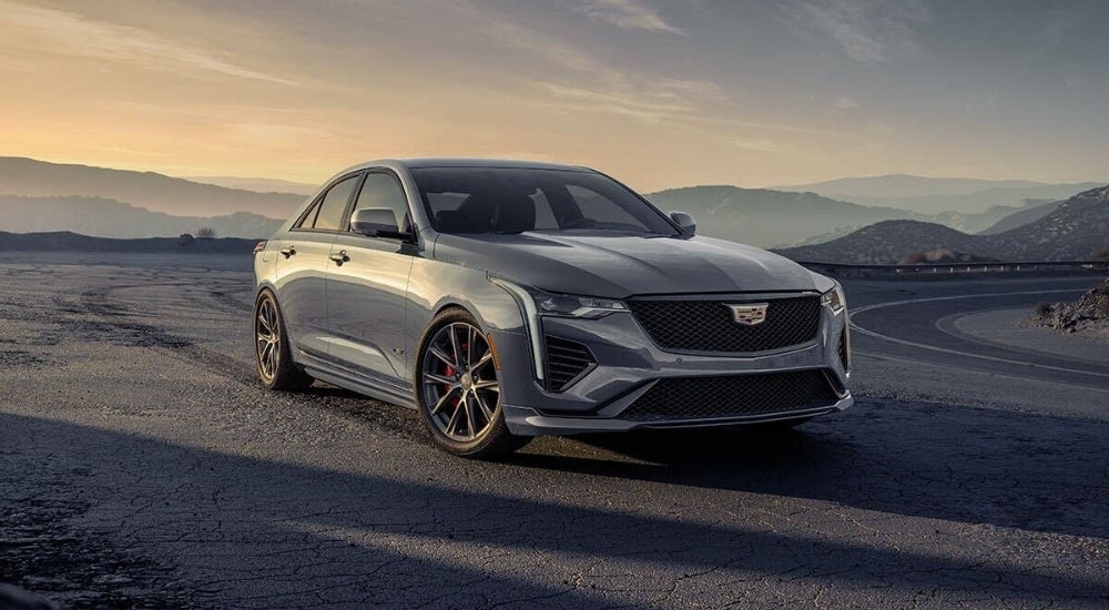 A grey 2024 Cadillac CT4-V is shown at dusk.