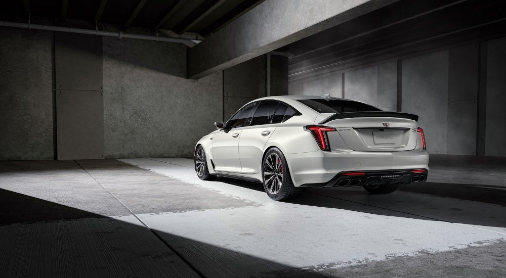 A white 2024 Cadillac CT5-V Blackwing is shown in a garage.