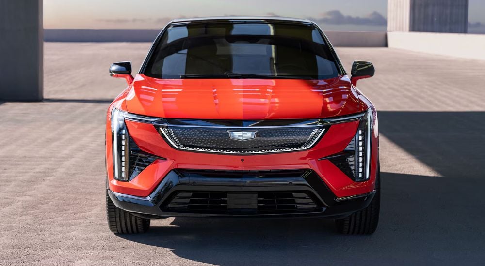 Head-on view of a red 2025 Cadillac OPTIQ Sport.