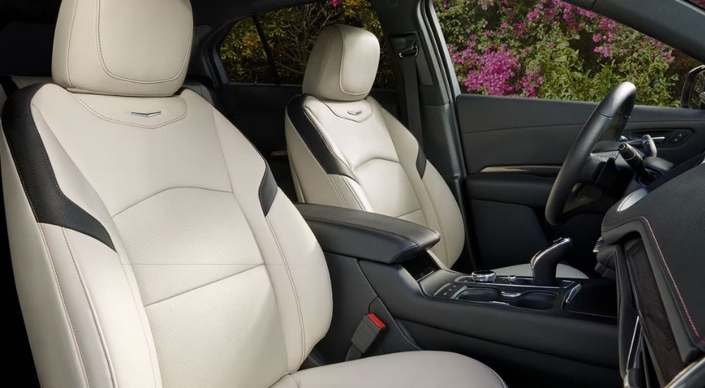 Cream leather seats are shown in a 2023 Cadillac XT4.