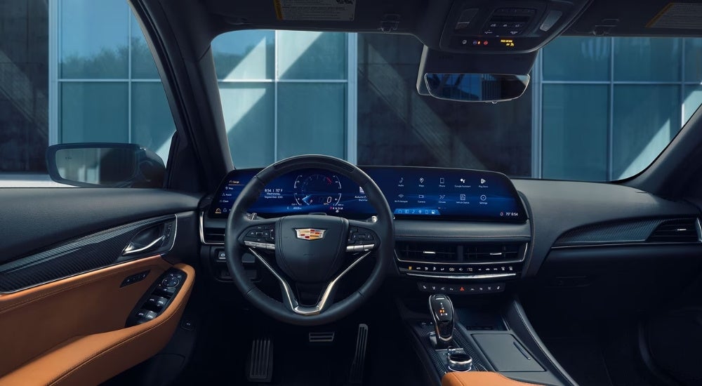 The black and brown interior is shown in a 2025 Cadillac CT5.