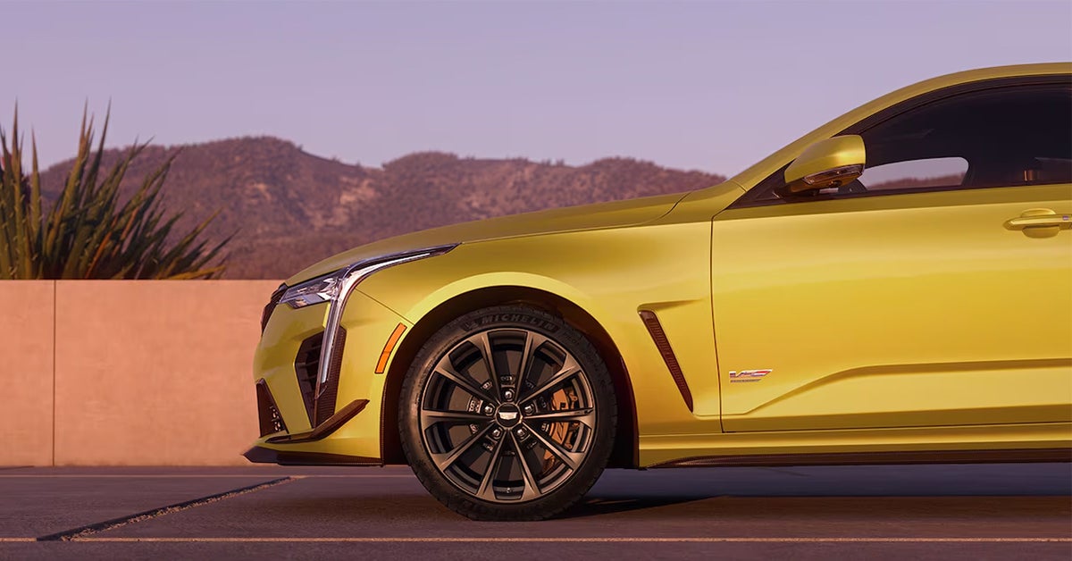 2025 Cadillac CT4-V Sedan side view with mirrors in view