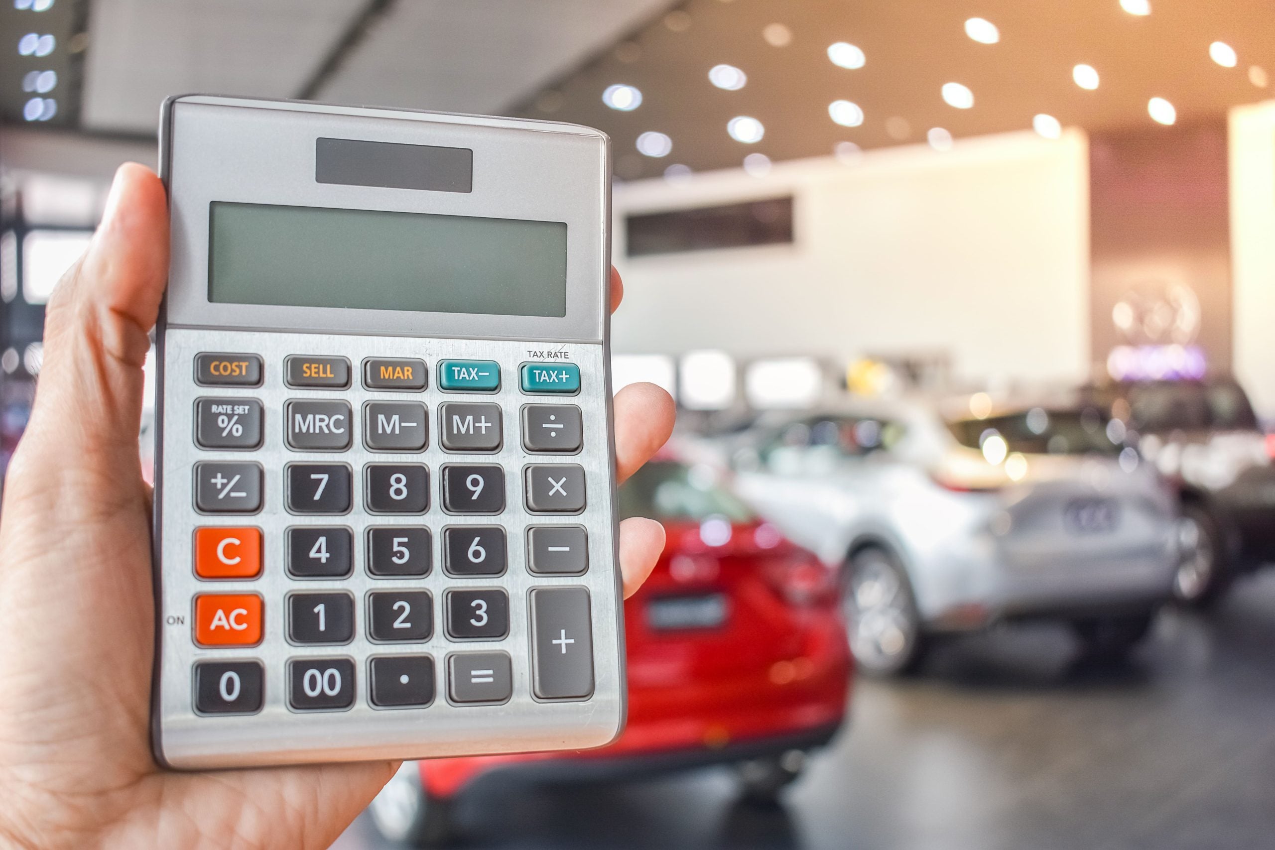 Person reviewing Cadillac financing options at a dealership in Central Florida