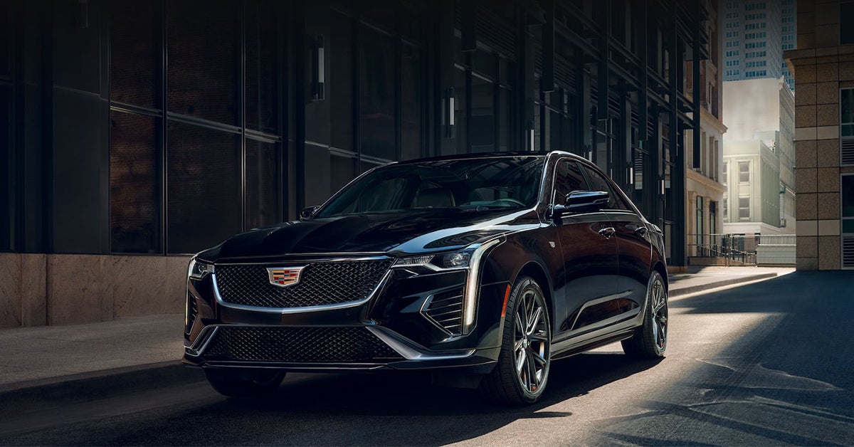 2025 Cadillac CT4 exterior driving down an urban street