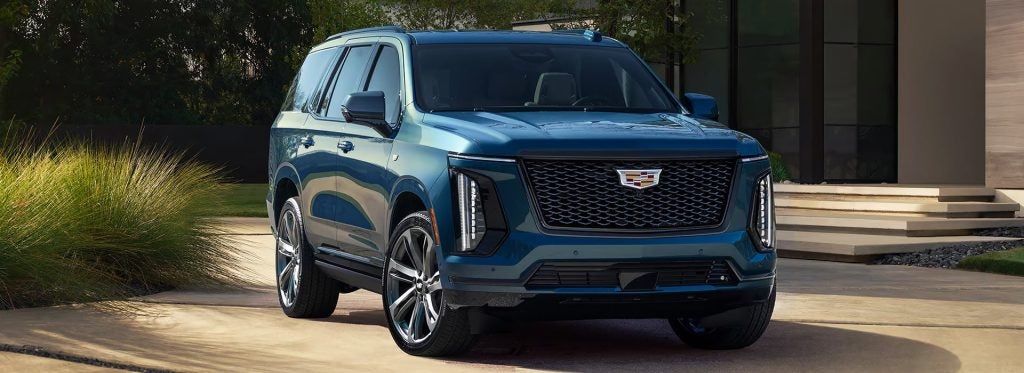 2025 Cadillac Escalade parked in front of a house