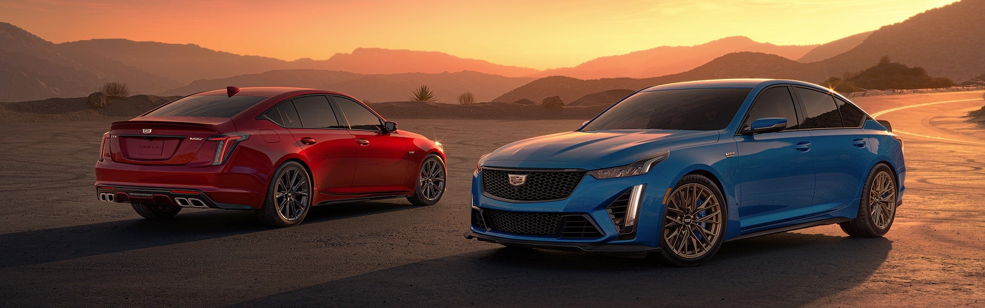 two CT5-V in front of a sunset