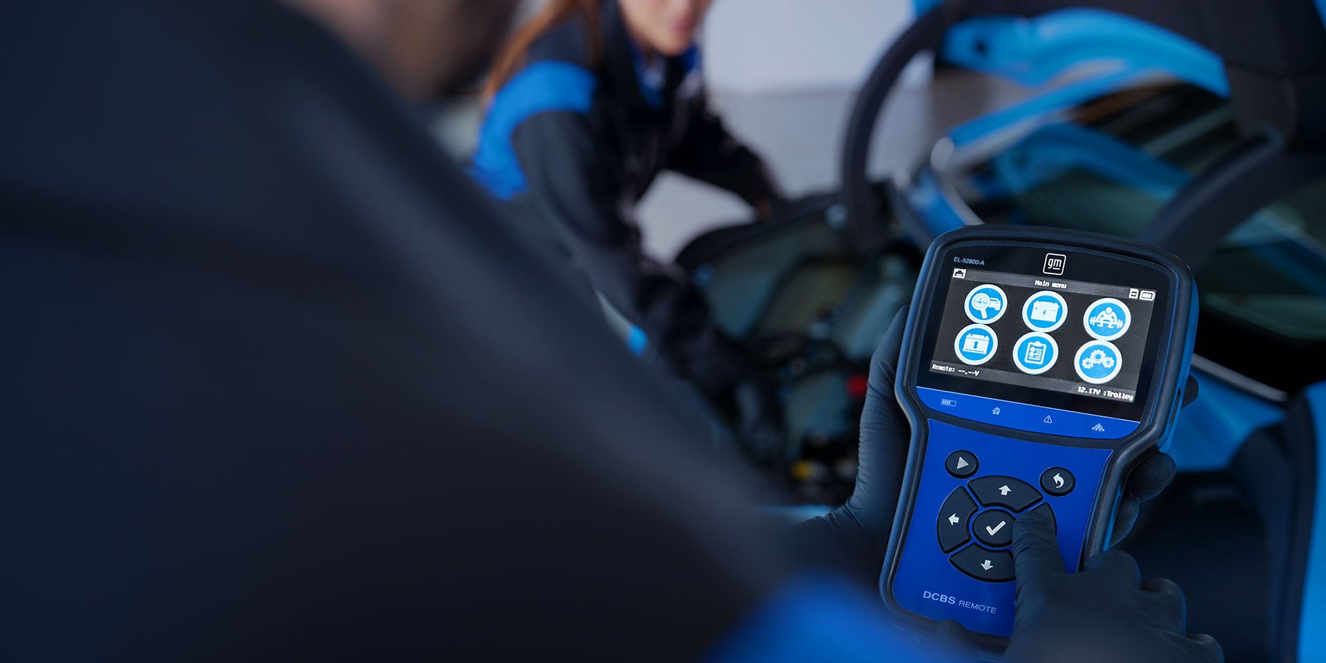 Cadillac Certified Service Advisor performing a test on a Cadillac vehicle for proper system starting