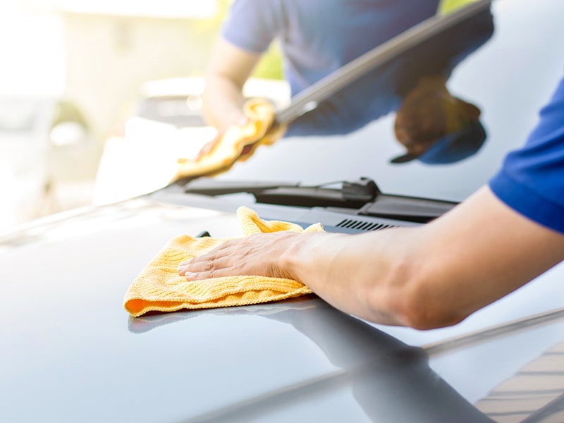 techs wiping down car