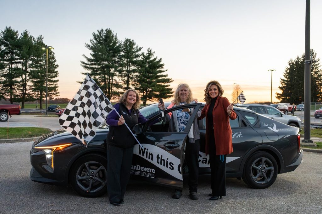 Leslie, the proud new owner of a stunning 2025 KIA K4, after winning the Hattie Larlham Thrive &amp; Drive Car Raffle 