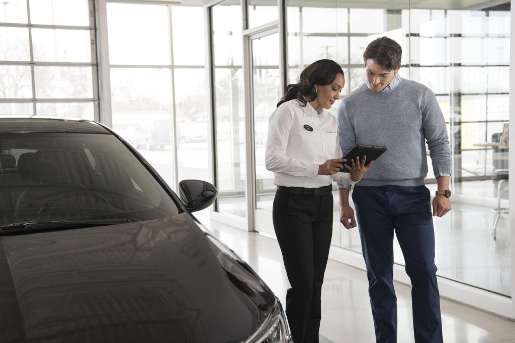 A salesperson going over the Buick Warranty options in Akron, OH 