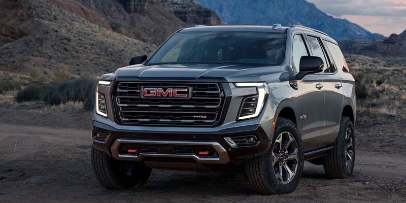 GMC SUV parked on a rugged off-road terrain