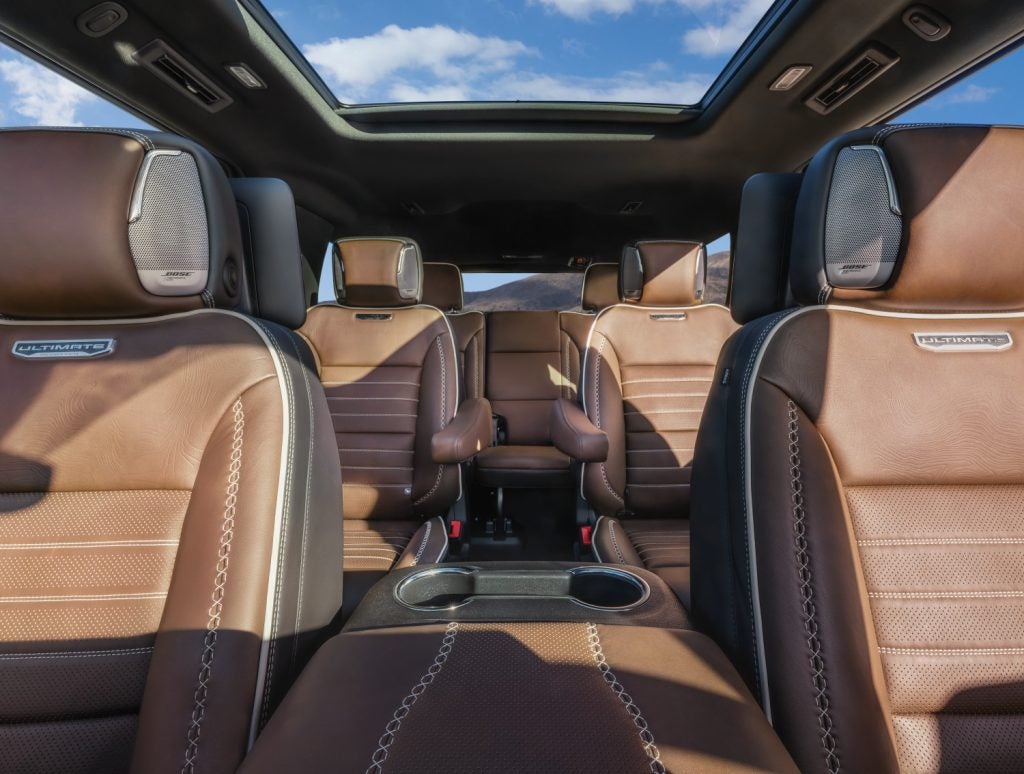 2026 GMC Yukon Denali Ultimate front view to rear passenger seats showing BOSE in headrests and view of sunroof