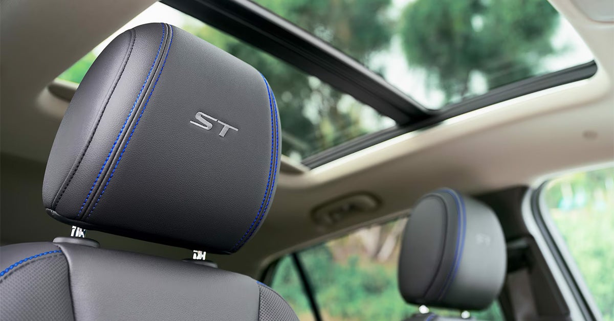 2025 Buick Encore GX seat headrest with ST logo and sunroof in the background