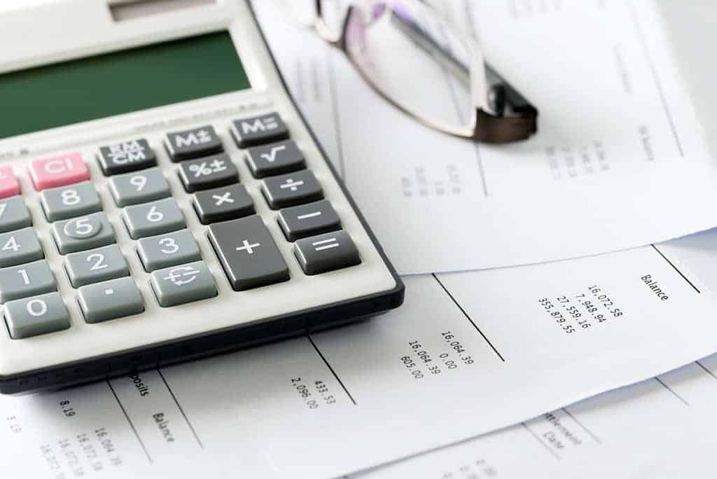 Calculator with financial paperwork