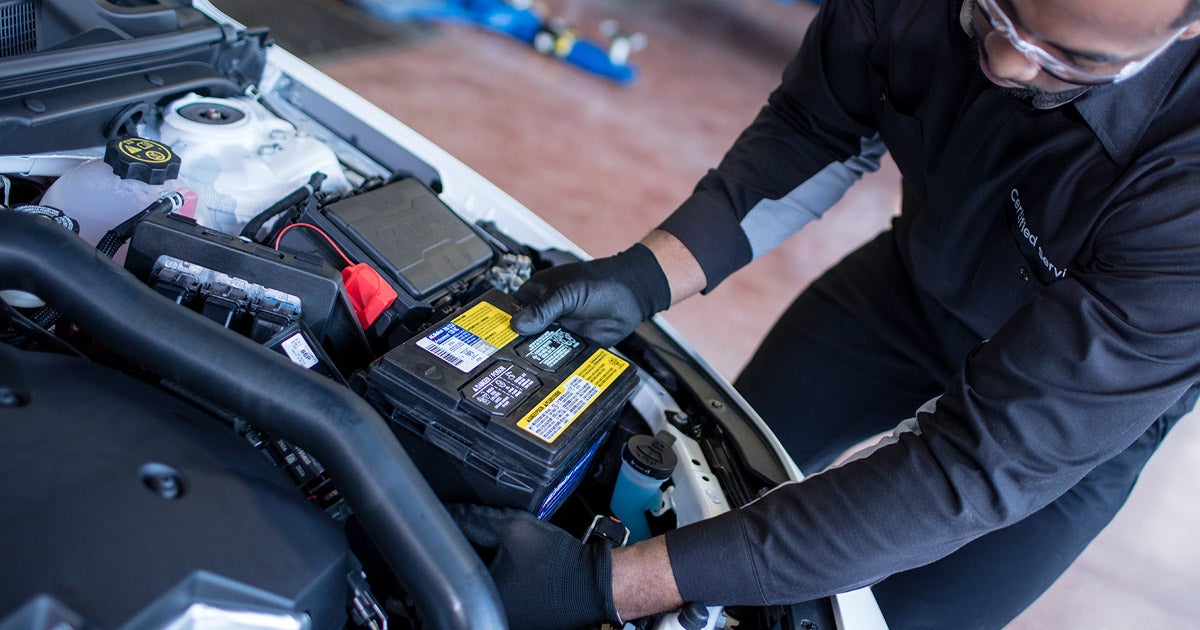 service technician installing vehicle battery