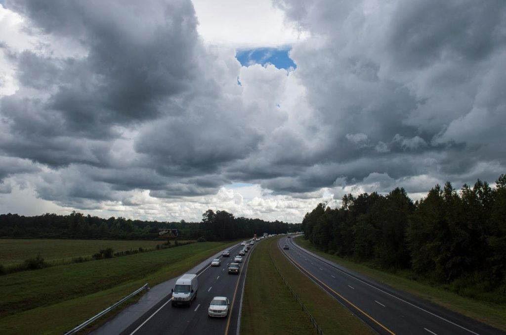 Dark clouds gathered across the sky