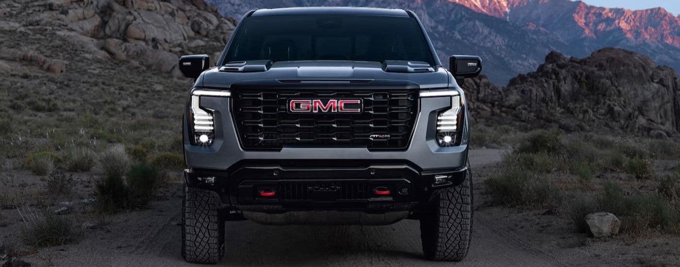 A gray 2027 GMC Sierra 1500 AT4X parked offroad.