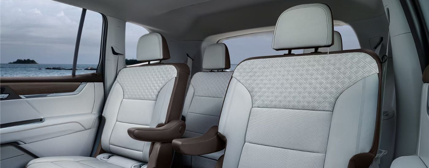 2nd and 3rd row light and dark gray seating in a 2027 GMC Acadia.