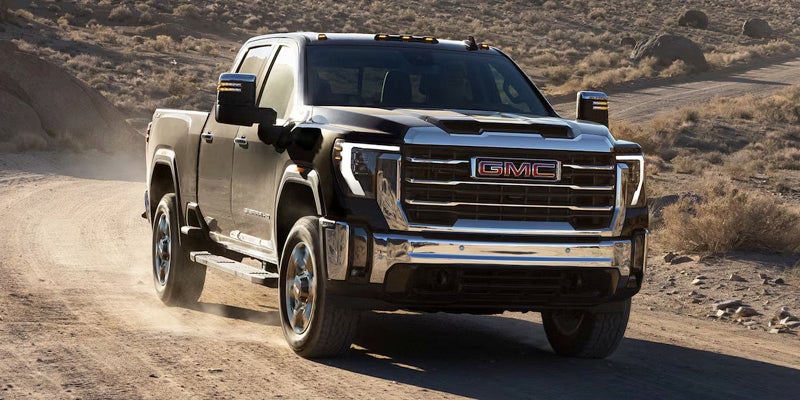 A 2025 GMC Sierra HD driving off road in Bryant, AR