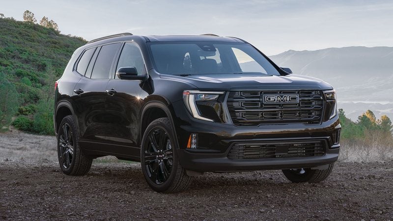 Black 2027 GMC Acadia Elevation parked on a hillside trail; GMC Acadia financing at Ross Downing GMC in Hammond, LA