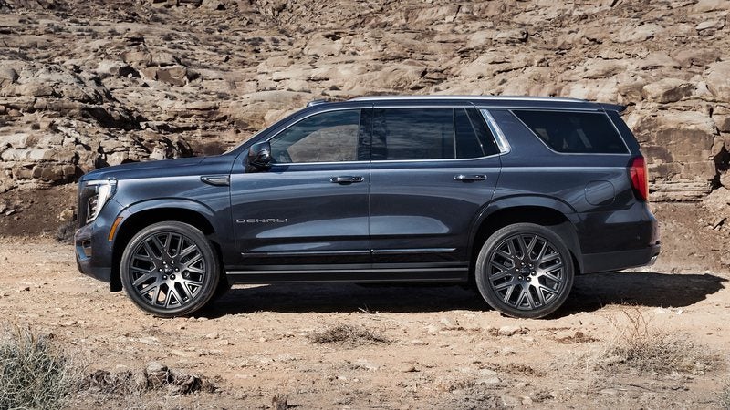 Dark blue 2026 GMC Yukon parked on a desert trail; trade in your vehicle at Ross Downing GMC in Hammond, LA