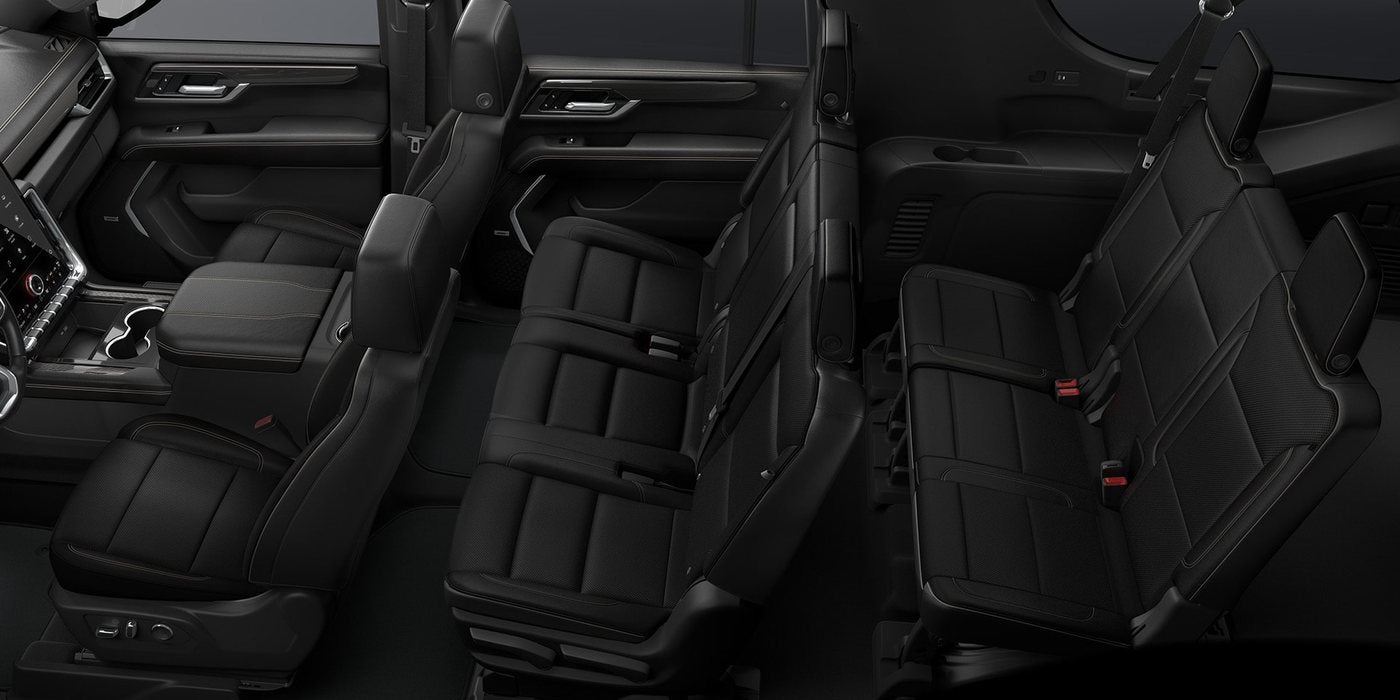 Three rows of black leather seats in a 2026 GMC Yukon, at Ross Downing GMC in Hammond, LA