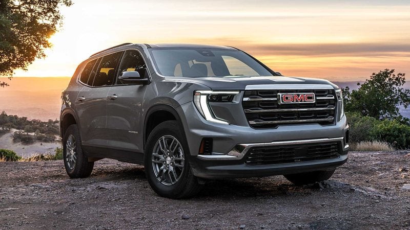 Gray 2027 GMC Acadia Elevation parked on a hilltop at sunset; GMC Acadia deals at Ross Downing GMC in Gonzales, LA