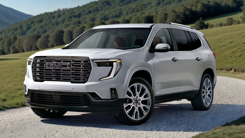Silver 2027 GMC Acadia Denali Ultimate on a gravel road through green hills; trade in your vehicle at Ross Downing GMC in Gonzales, LA