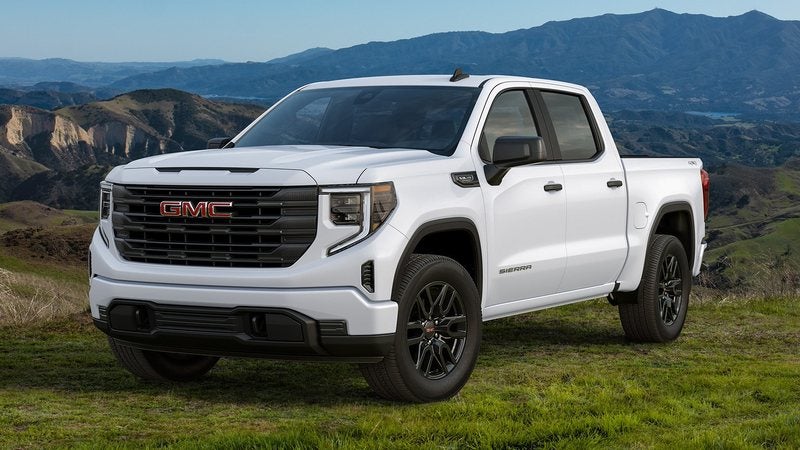 White 2026 GMC Sierra 1500 Elevation on a grassy hilltop; GMC Sierra 1500 financing at Ross Downing GMC in Gonzales, LA