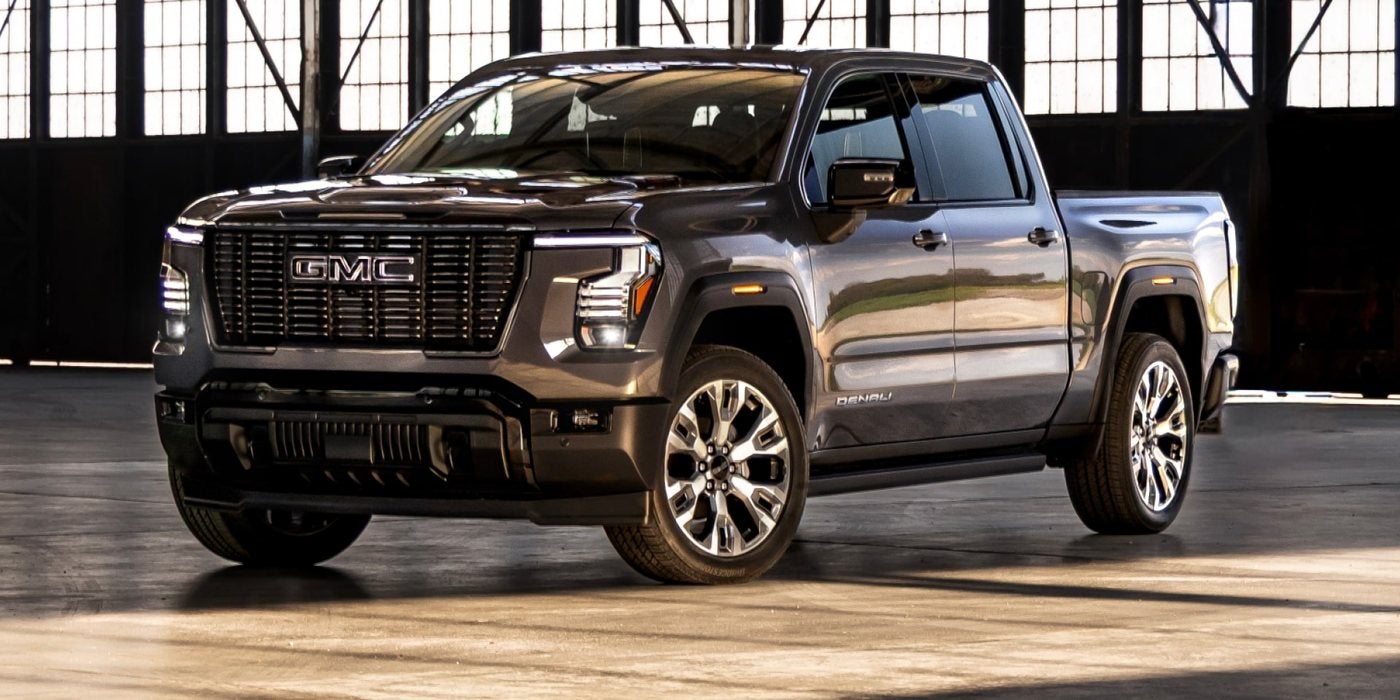 Gray 2027 GMC Sierra 1500 Denali Ultimate in a hangar; 2026 vs 2027 GMC Sierra 1500 at Ross Downing GMC in Gonzales, LA