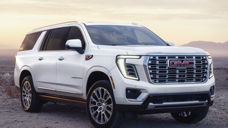 White 2027 GMC Yukon XL Denali at dusk; GMC Yukon XL financing at Ross Downing GMC in Gonzales, LA