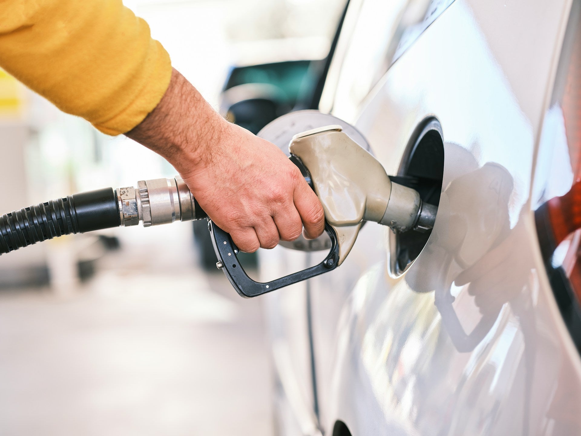Filling up a car with a gas pump