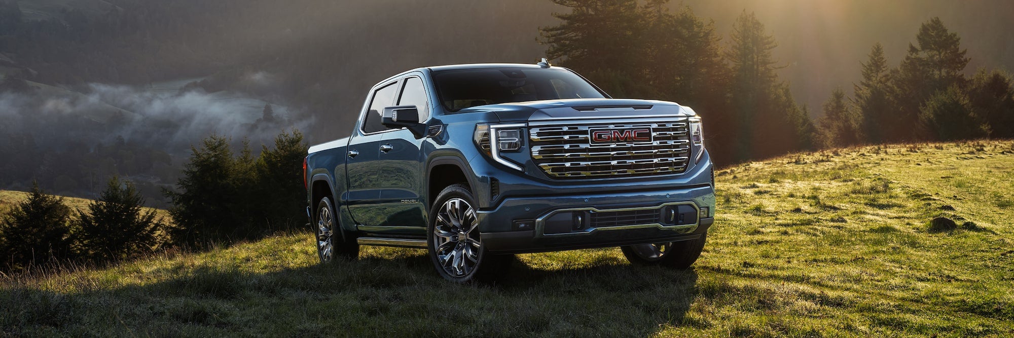 2026 GMC Sierra 1500 on sunny grassy hill