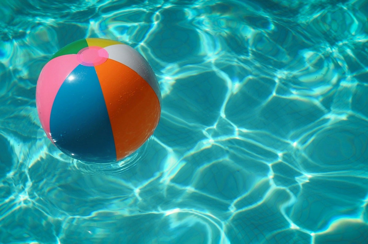 Beach ball floating in pool