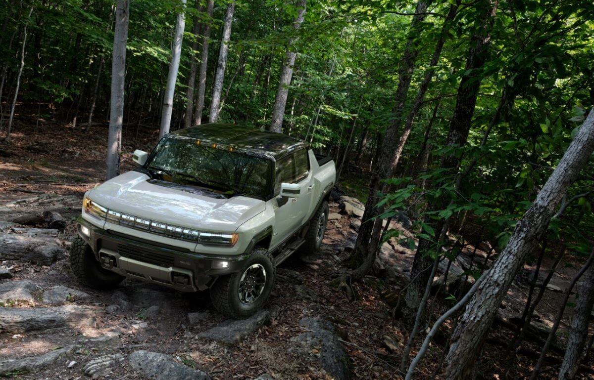 A 2023 Hummer EV is driving off-road.