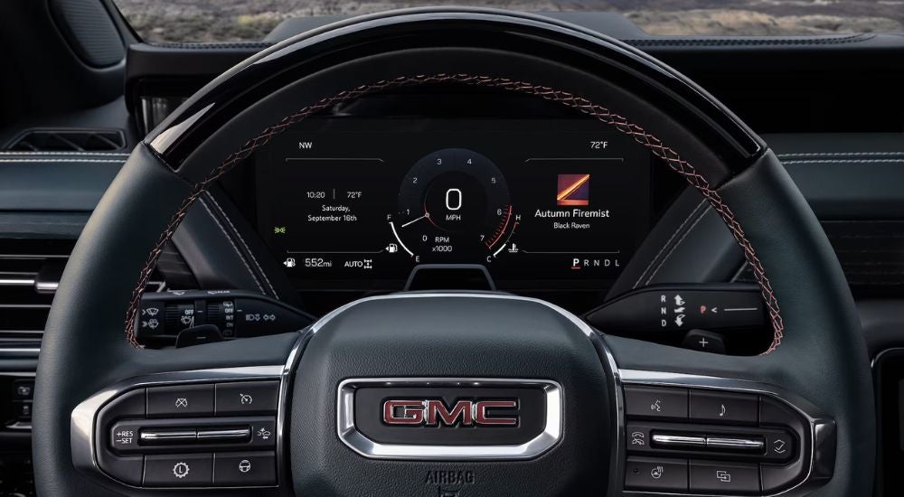 Steering wheel and digital gauge cluster on a 2026 GMC Yukon.
