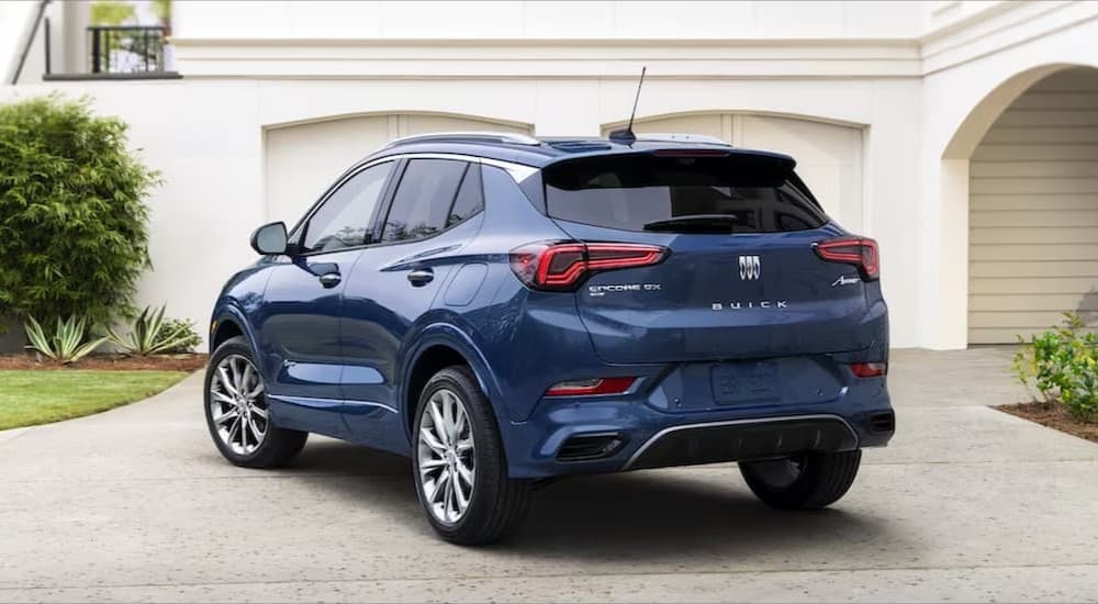 A blue 2023 Buick Encore GX parked on a driveway.