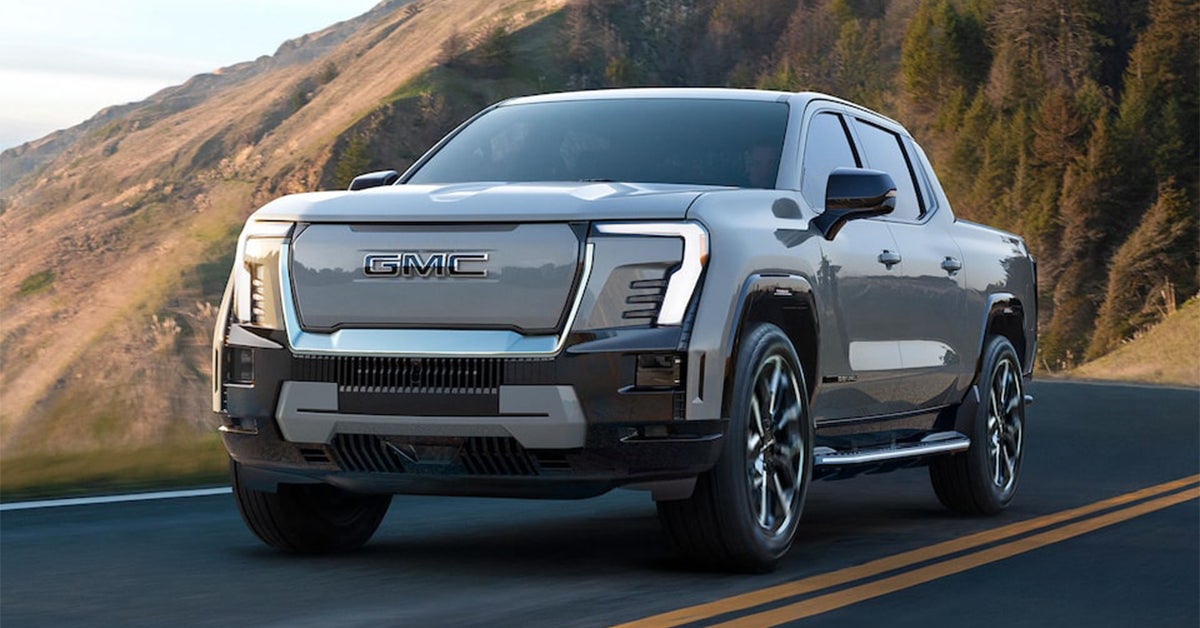 2025 GMC Sierra EV Denali truck driving on a mountain highway
