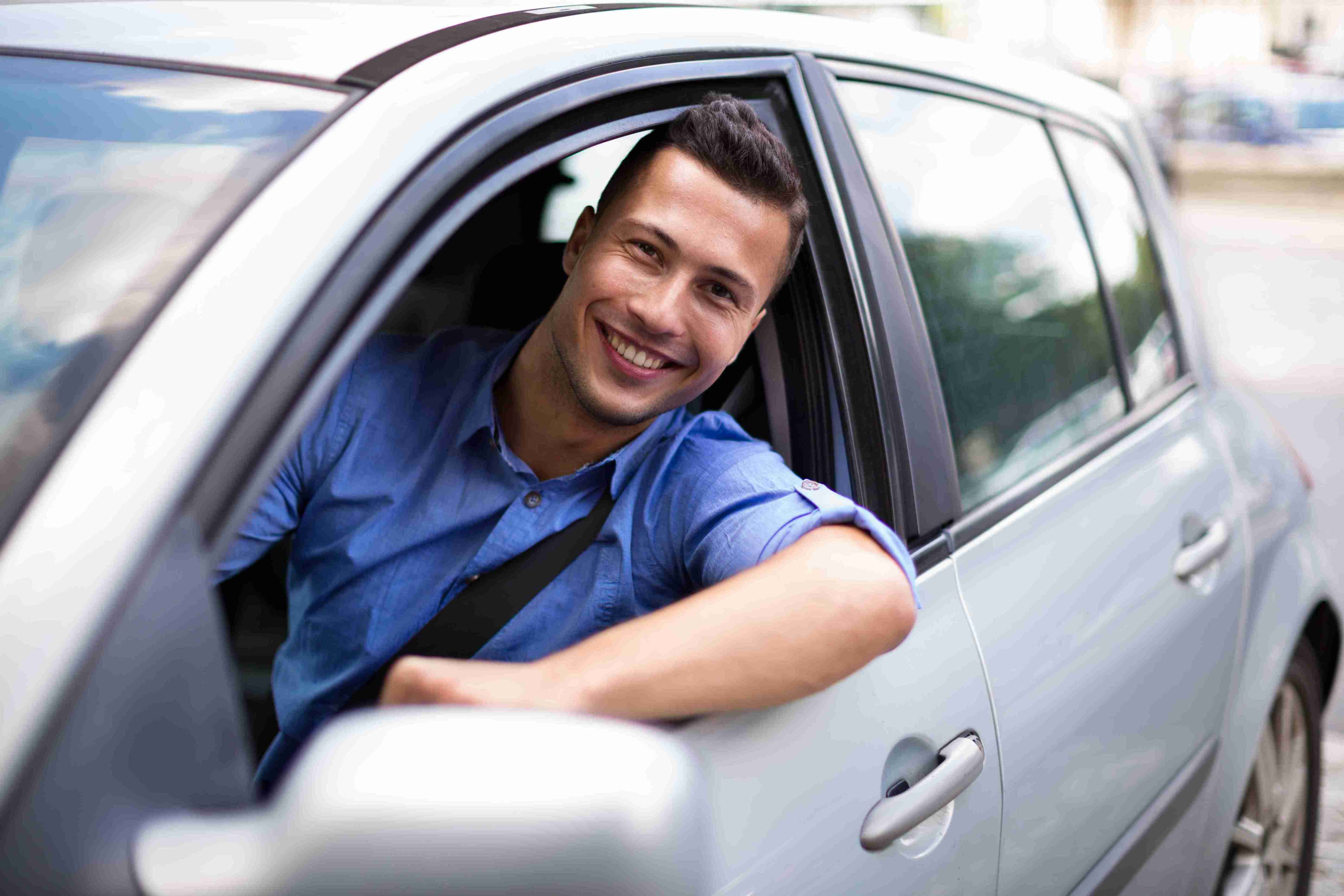 man driving a car