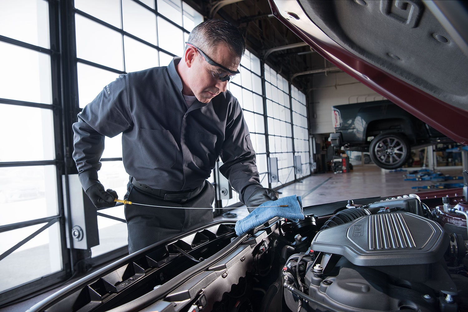 Buick service technician conducting an oil change