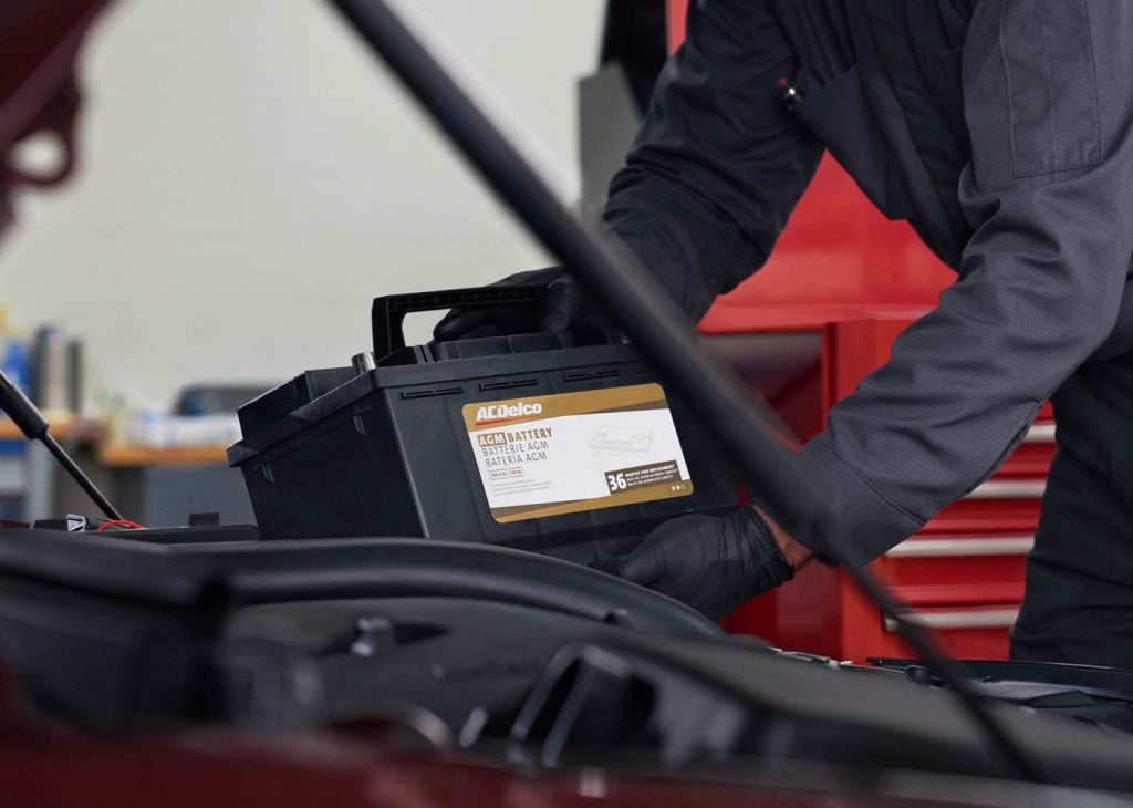 Service Tech replacing a battery