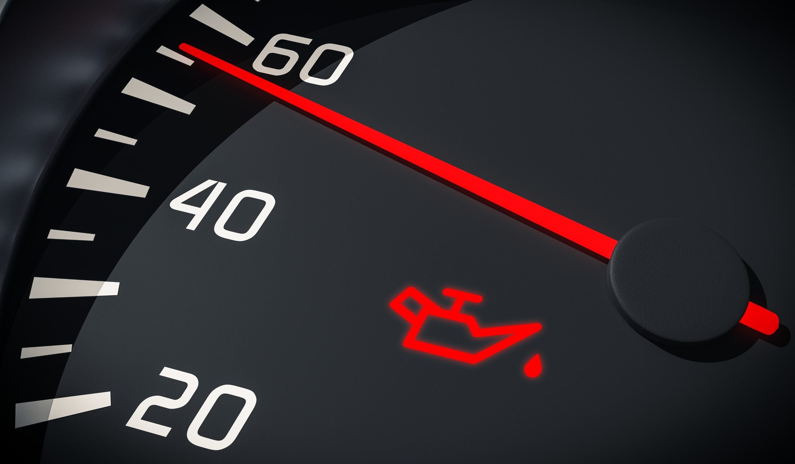 Car speedometer with the oil change light on