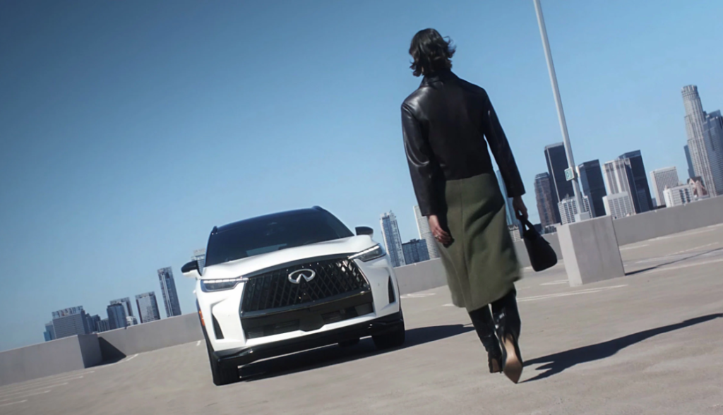 A driver walking back to their INFINITI QX60 in Benton, AR 
