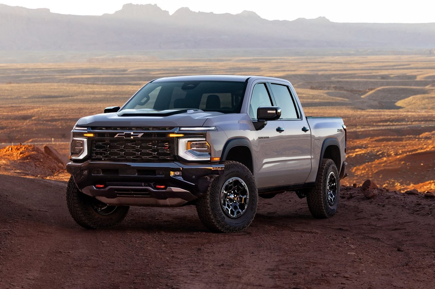 2027 Chevy Silverado 1500 three-quarter front view in the desert