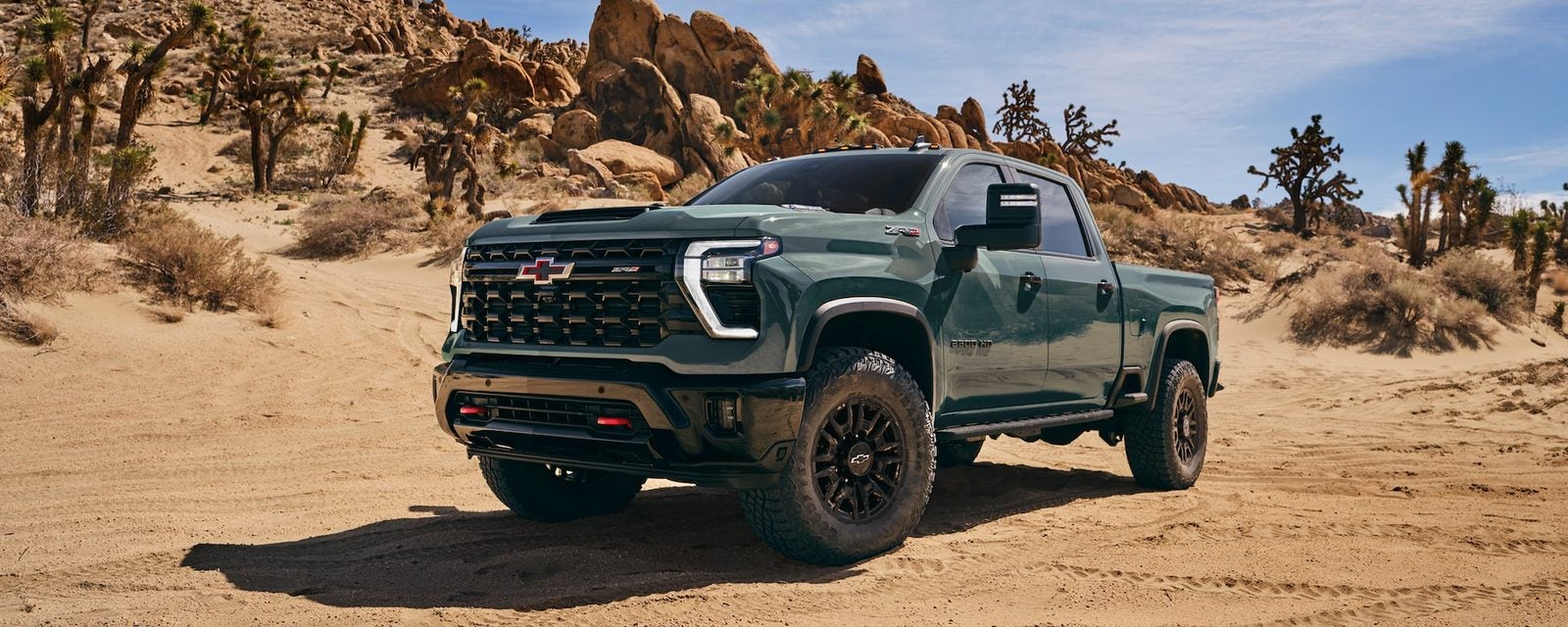 2026 Chevy Silverado HD driving off-road, sold new at Ross Downing Chevrolet in Hammond, LA